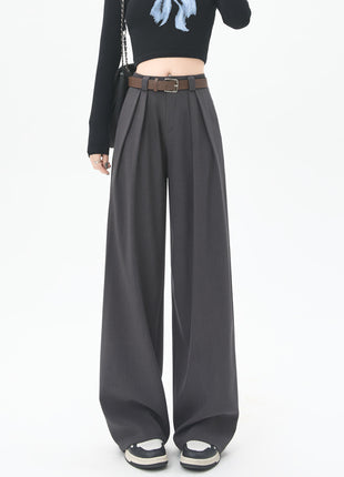 Person wearing wide-leg gray pants on a white background blndl