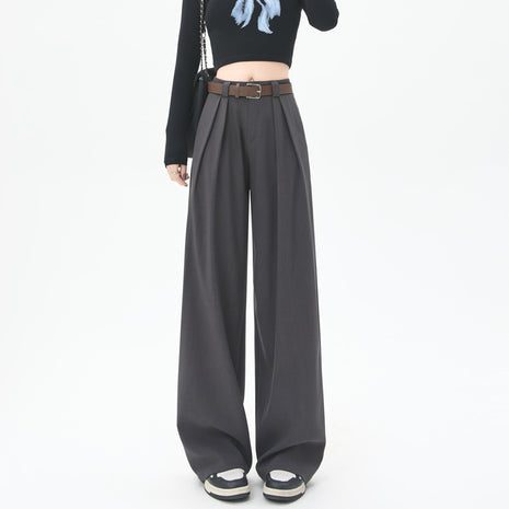 Person wearing wide-leg gray pants on a white background blndl