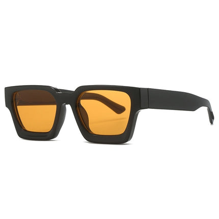 Sunglasses with black frame and yellow-tinted lenses on a white background