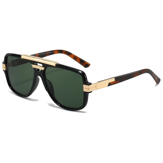 Sunglasses with black frame, gold accents, and green lenses on a white background