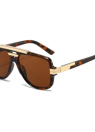 Sunglasses with brown lenses and tortoiseshell frame on a white background