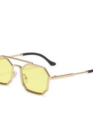 Sunglasses with gold frame and yellow lenses on a white background