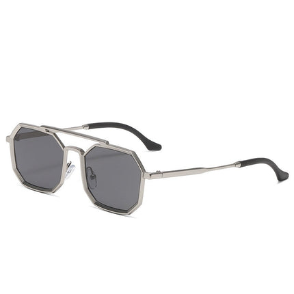 Sunglasses with metallic frame and dark lenses on a white background