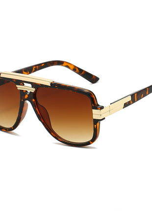 Sunglasses with tortoiseshell frame and brown gradient lenses on a white background