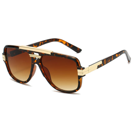 Sunglasses with tortoiseshell frame and brown gradient lenses on a white background