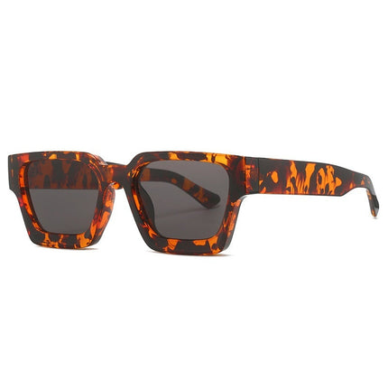 Sunglasses with tortoiseshell frame and dark lenses on a white background
