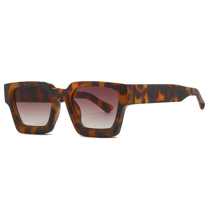 Sunglasses with tortoiseshell frame and gradient lenses on a white background