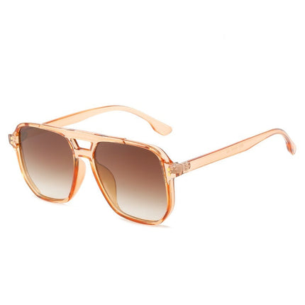 Sunglasses with transparent tea frame and brown gradient lenses on a white background