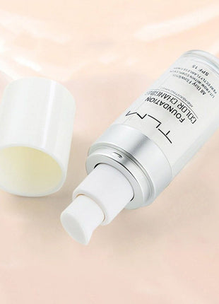 Skincare product with applicator on a light pink background
