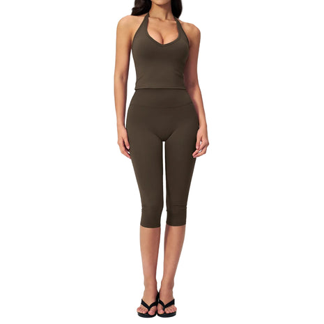 Two-piece women's activewear set with a fitted sleeveless top and stretchy capri pants for yoga and workouts.