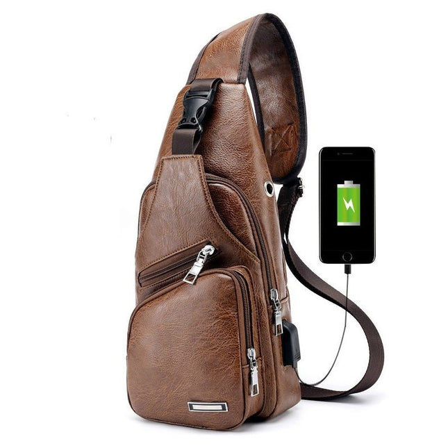 Brown leather sling bag with USB charging cable and smartphone on a white background