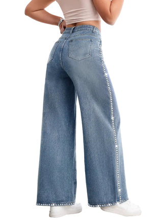 Women’s vintage washed blue jeans with multi-pocket design and comfortable wide-leg fit.