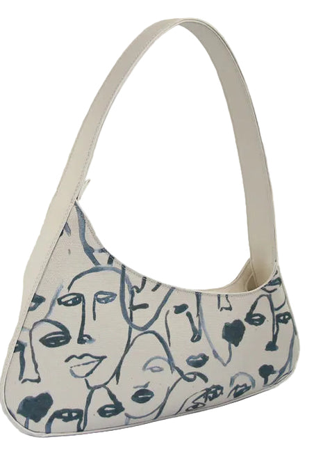 Vintage white canvas shoulder bag with character print, zipper closure, and single shoulder strap for casual everyday use blndl