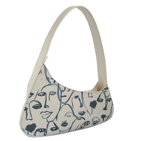 Vintage white canvas shoulder bag with character print, zipper closure, and single shoulder strap for casual everyday use blndl