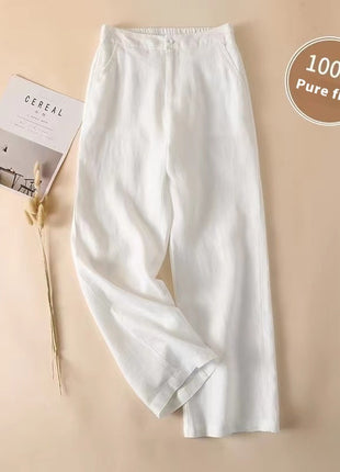 White pants on a beige background with '100% Pure flax' label.