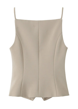 Women's French-inspired button-front sling top paired with tailored trousers for a sophisticated everyday look.