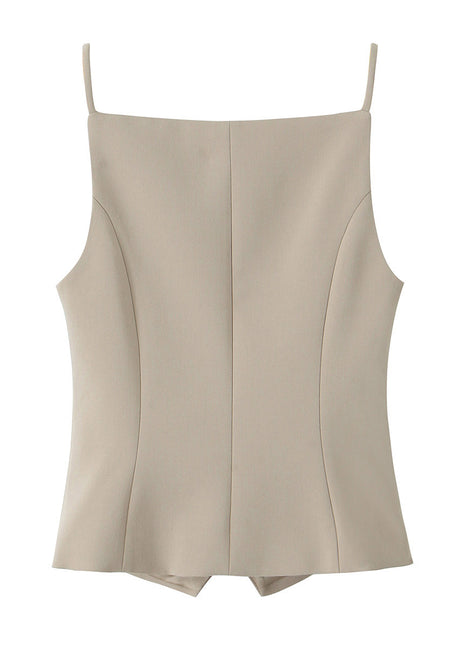 Women's French-inspired button-front sling top paired with tailored trousers for a sophisticated everyday look.