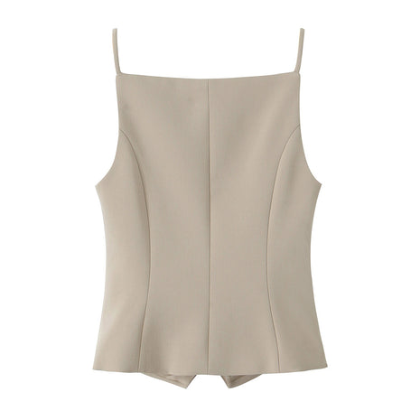 Women's French-inspired button-front sling top paired with tailored trousers for a sophisticated everyday look.
