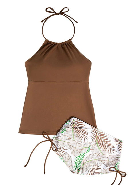 Brown halter top and leaf-patterned shorts on a white background with sunglasses and a leaf.