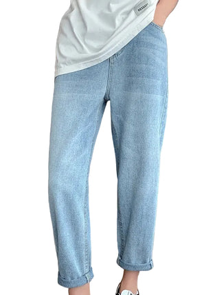 Women’s high waist harem jeans with loose fit denim design and cropped casual style.