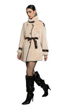 Women’s leather design jacket with regular sleeves and cozy faux fur collar for winter wear.