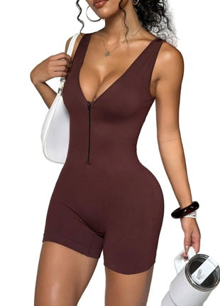 Woman wearing a brown bodysuit against a neutral background