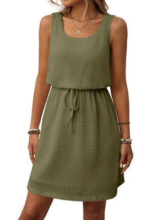 Army green vest style dress with adjustable waist and minimalist casual fashion design.