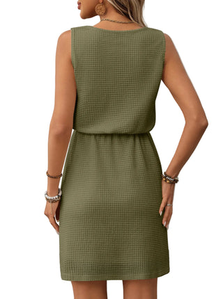 Army green vest style dress with adjustable waist and minimalist casual fashion design.
