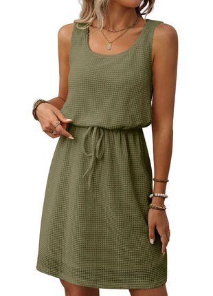 Army green vest style dress with adjustable waist and minimalist casual fashion design.