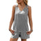 Woman wearing a black and white striped sleeveless top and shorts set outdoors.