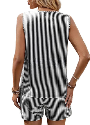 Woman wearing a black and white striped outfit with a blurred background