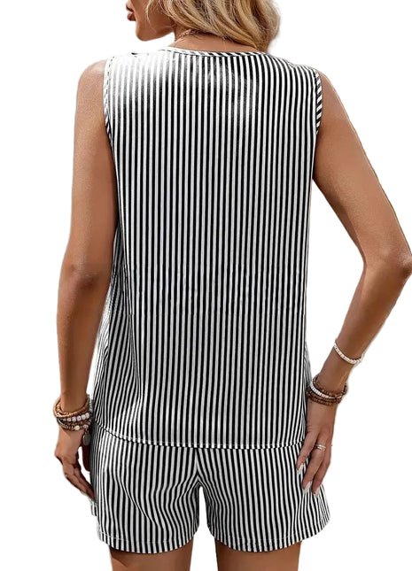 Woman wearing a black and white striped outfit with a blurred background