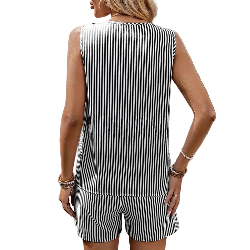 Woman wearing a black and white striped outfit with a blurred background