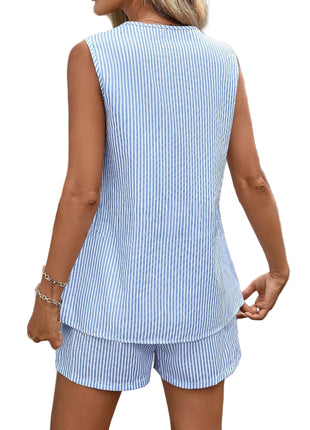 Person wearing a blue and white striped outfit with a blurred background