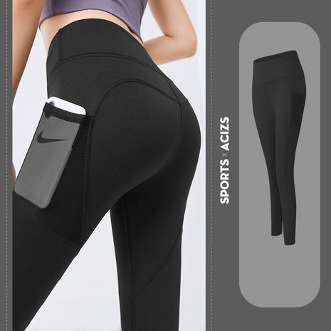 Black leggings with a pocket and Nike branding, on a light gray background.