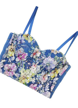 Women's denim blue strapless corset top featuring molded cups and detachable lace-up shoulder straps.