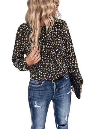 Women's elegant long sleeve bow collar blouse styled with tailored trousers for office wear.