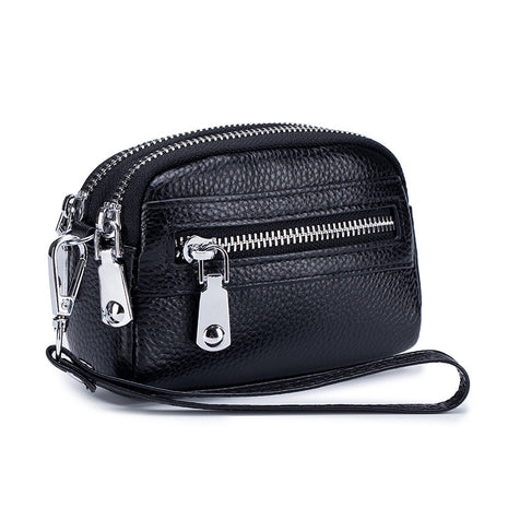 Women's first layer cowhide double zipper coin clutch made from genuine leather with compact storage design.