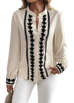 Women's lightweight polyester long sleeve shirt with buckle-inspired detailing for everyday comfort.