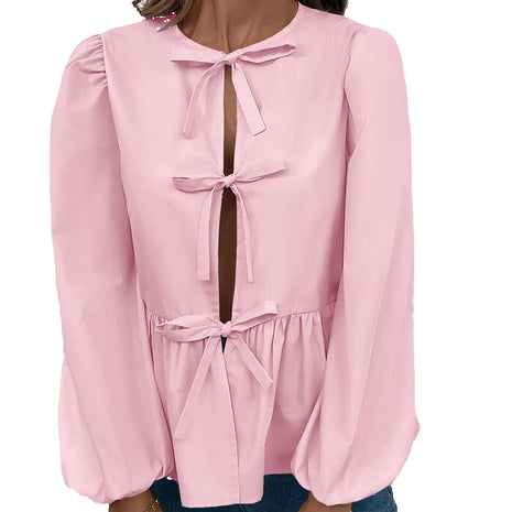 Women's loose-fit buckle shirt available in black, pink, white, and light blue for everyday casual fashion.