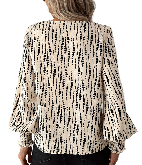 Women's loose-fit long sleeve shirt paired with jeans for a stylish street-inspired casual outfit.