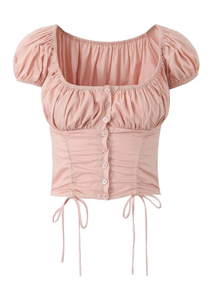 Women's pink drawstring crop top featuring lace trim, shell-style buttons, and a printed design.