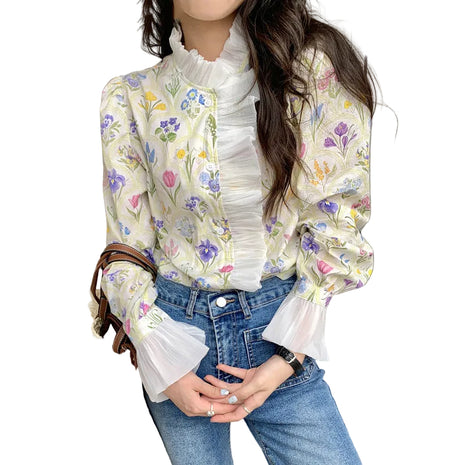 Women's romantic turtleneck blouse featuring ruffled flare sleeves, patchwork details, and a delicate off-white floral design.