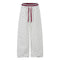 Women's ruffle-trimmed polka dot straight-leg pants featuring a mid-rise waist and cotton fabric.