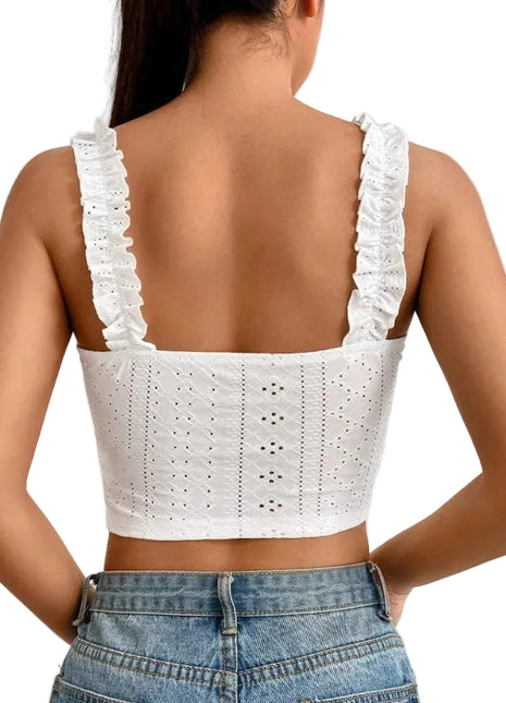 Women's slim-fit knitted camisole paired with high-waisted trousers for an elegant minimalist look.