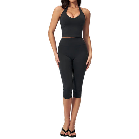 Women's slimming yoga outfit set featuring a sleeveless top and capri-length pants in soft nylon-spandex fabric.