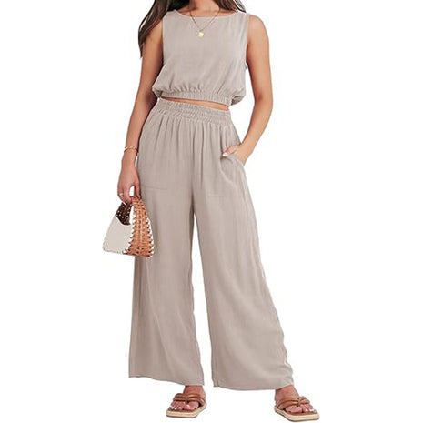 Conjunto de dos piezas de cuello redondo sin mangas, bajo asimétrico y pantalón de pierna ancha de talle alto