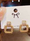 gold H letter