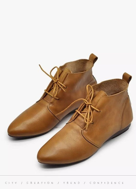 Botines planos versátiles de cuero suave y cómodo
