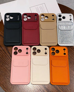 Collection of phone cases in various colors on a wooden surface